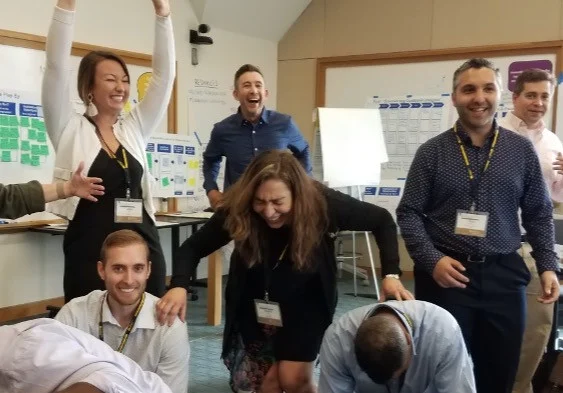 Participants sharing a laugh during a group workshop