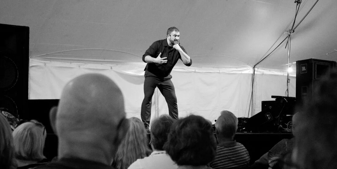 Scott Whitehair telling a story to an audience