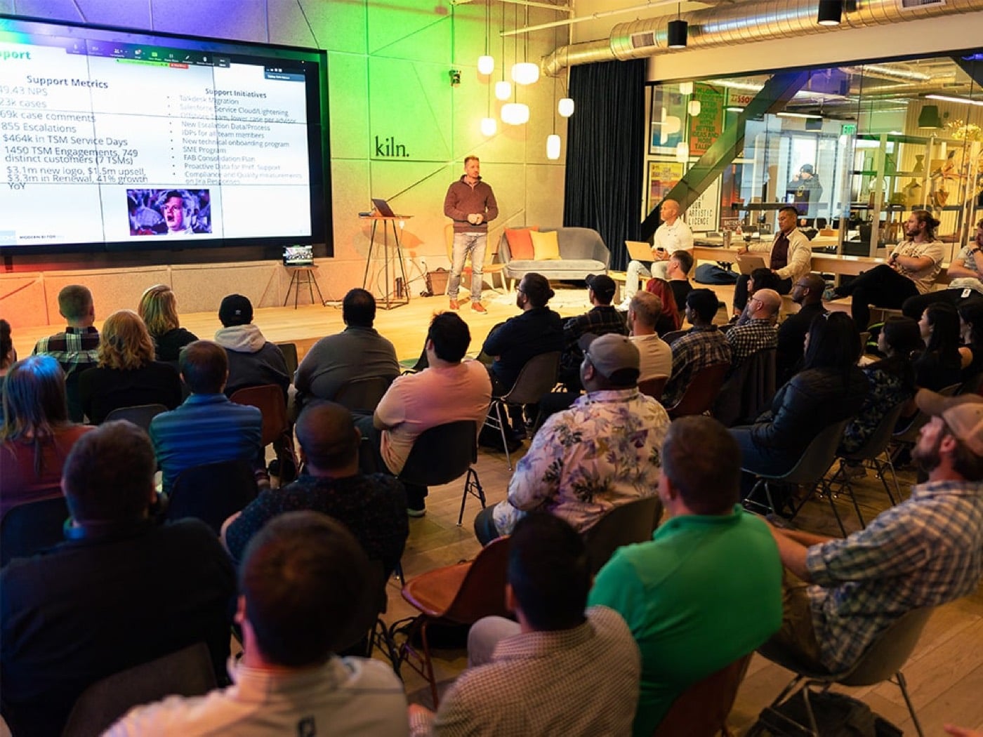 A debate event on stage in front of a full crowd